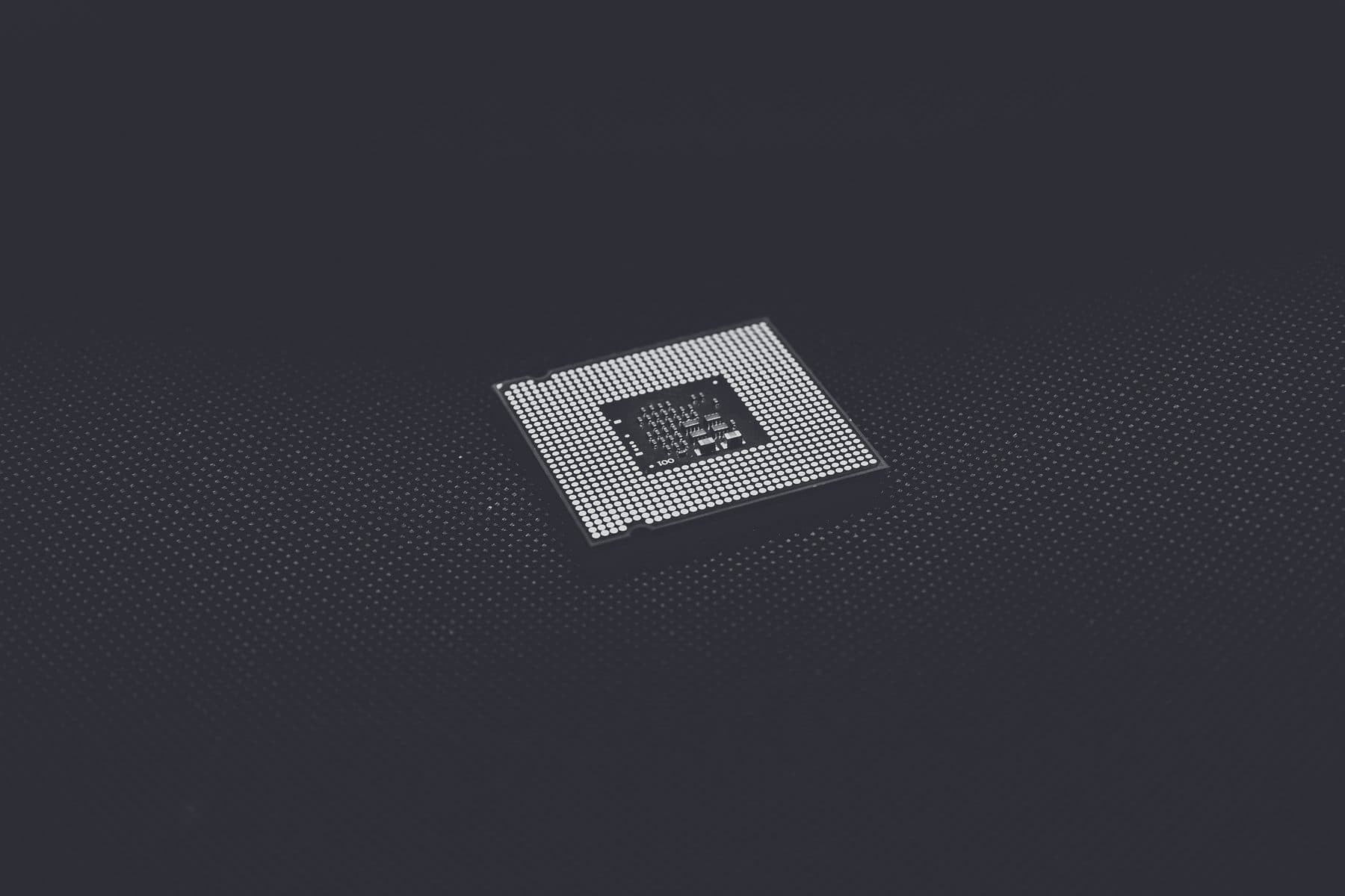 Macro view of a processor die on a dark surface